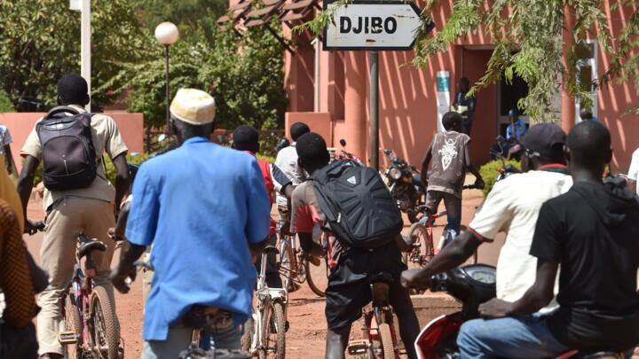 Residents ride bicycles on October 29, 2018, in the center of Ouahigouya, eastern Burkina Faso.